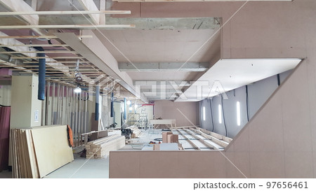 Indoor golf course construction. Interior. People. Structure. Wall. Wood. Carpentry Indoor golf course construction. Interior. People. Structure. Wall. Wood. Carpentry 97656461