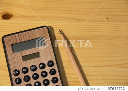 Wood grain image calculator and pencil Wood grain image calculator and pencil 97657712