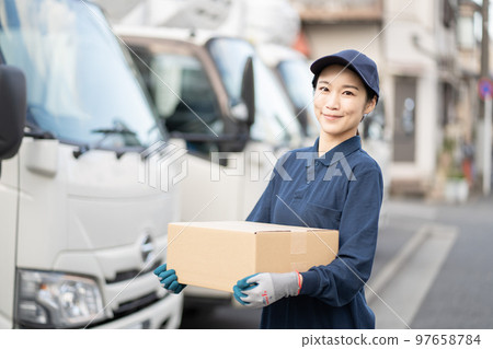 Young female worker in delivery industry Young female worker in delivery industry 97658784
