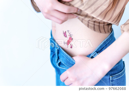 A woman with a tattoo [parts cut] 97662088