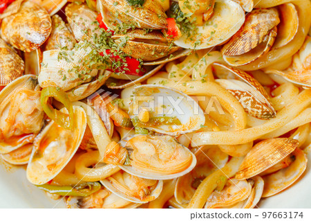 Spicy delicious Chinese authentic food Clam Mara stir-fried noodles dish in white bowl 97663174