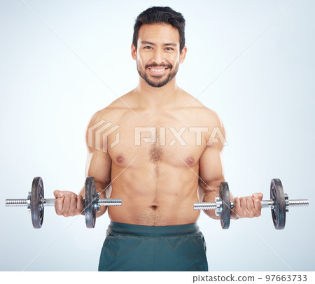 Portrait, fitness or man training with dumbbell in workout or exercise in studio for strong arms, biceps or body goals. Muscles, mindset or happy bodybuilder sports athlete weightlifting with mock up Portrait, fitness or man training with dumbbell in workout or exercise in studio for strong arms, biceps or body goals. Muscles, mindset or happy bodybuilder sports athlete weightlifting with mock up 97663733
