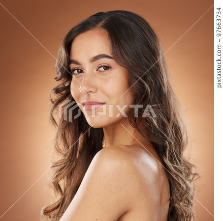 Beauty, hair and salon with portrait of woman for cosmetics, fashion and luxury treatment. Wellness, hair care and shine with face of girl model for keratin, glow and self care in brown background Beauty, hair and salon with portrait of woman for cosmetics, fashion and luxury treatment. Wellness, hair care and shine with face of girl model for keratin, glow and self care in brown background 97663734