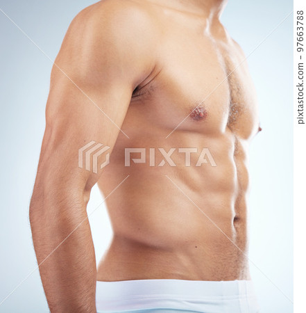 Fitness, wellness and body of man in studio with muscles for healthy lifestyle, workout and bodybuilder training. Motivation, exercise and muscular torso, abdomen and stomach of athlete in underwear Fitness, wellness and body of man in studio with muscles for healthy lifestyle, workout and bodybuilder training. Motivation, exercise and muscular torso, abdomen and stomach of athlete in underwear 97663788