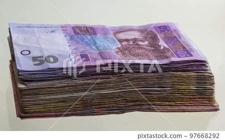 Bundles of Ukrainian hryvnia banknotes. Ukrainian hryvnia banknotes, large amount in packs 97668292