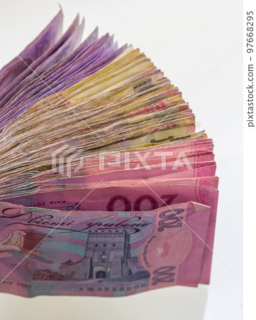 Ukrainian hryvnias bills lies isolated on white background with copy space stacked in fan close up. Payday time concept or financial operations 97668295