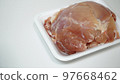Raw chicken breast in a plastic container 97668462