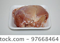 Raw chicken breast in a plastic container 97668464