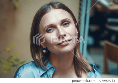 Woman portrait, in a cafe close up Woman portrait, in a cafe close up 97668913