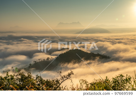 Majestic view of Doi Luang Chiang Dao in northern Thailand, the third highest mountain in Thailand, seen with beautiful dramatic clouds and colorful sky Majestic view of Doi Luang Chiang Dao in northern Thailand, the third highest mountain in Thailand, seen with beautiful dramatic clouds and colorful sky 97669599