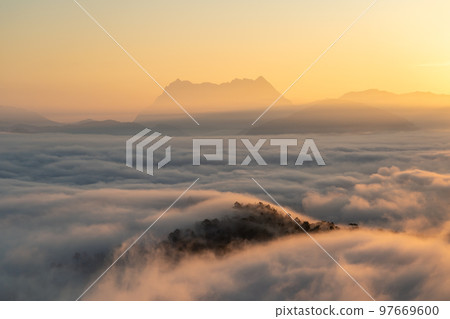 Majestic view of Doi Luang Chiang Dao in northern Thailand, the third highest mountain in Thailand, seen with beautiful dramatic clouds and colorful sky 97669600