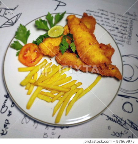 fish and chips meal breaded cod fish fillet with French fries served on plate good british meal usually served in a pub fish and chips meal breaded cod fish fillet with French fries served on plate good british meal usually served in a pub 97669973