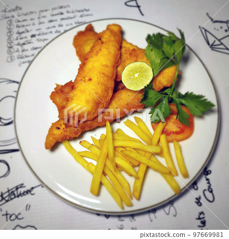 fish and chips meal breaded cod fish fillet with French fries served on plate good british meal usually served in a pub fish and chips meal breaded cod fish fillet with French fries served on plate good british meal usually served in a pub 97669981