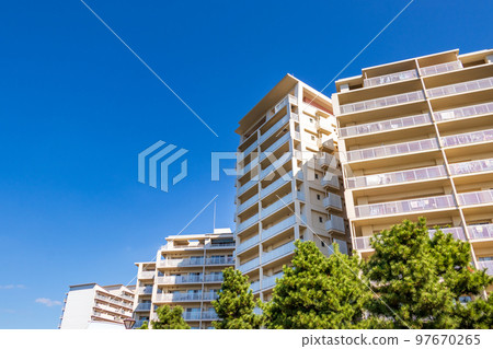 view of white apartment from below 97670265