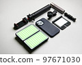 Equipment for shooting video on a smartphone. Microphone, LED lamp, tripod, lens smartphone are on a white table 97671030