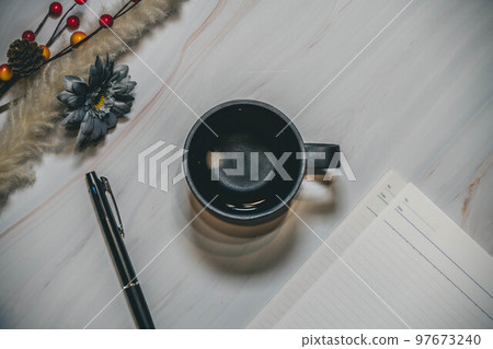 Marble background and interior cups and writing utensils 97673240