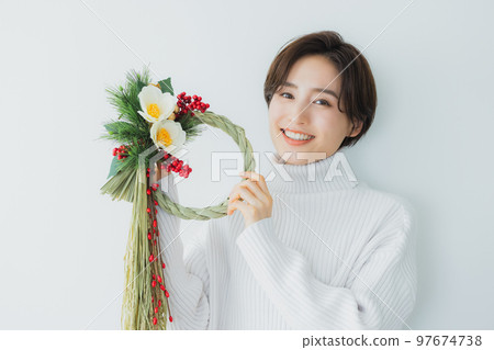 A woman with a shimenawa decoration 97674738