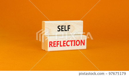 Self reflection symbol. Concept word Self reflection typed on wooden blocks. Beautiful orange table orange background. Business psychological and self reflection concept. Copy space. Self reflection symbol. Concept word Self reflection typed on wooden blocks. Beautiful orange table orange background. Business psychological and self reflection concept. Copy space. 97675179