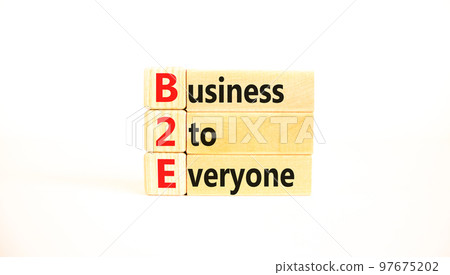 B2E business to everyone symbol. Concept words B2E business to everyone on wooden blocks on a beautiful white table white background. Business and B2E business to everyone concept. Copy space. B2E business to everyone symbol. Concept words B2E business to everyone on wooden blocks on a beautiful white table white background. Business and B2E business to everyone concept. Copy space. 97675202