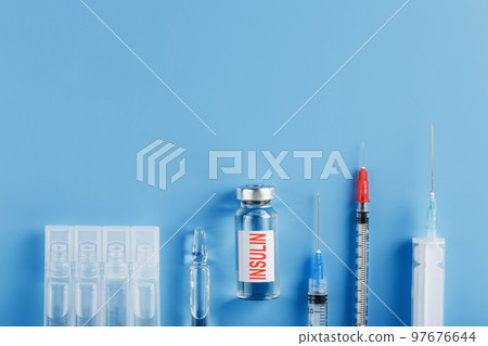 Medicine in ampoules with insulin, needles and syringes for medical subcutaneous injection Medicine in ampoules with insulin, needles and syringes for medical subcutaneous injection 97676644