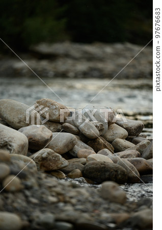 Coastal stones near the water, a place for copy space. Coastal stones near the water, a place for copy space. 97676683
