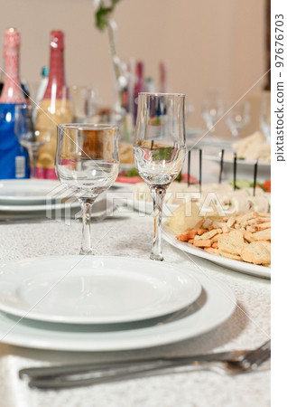Festive table set with food and drinks. 97676703