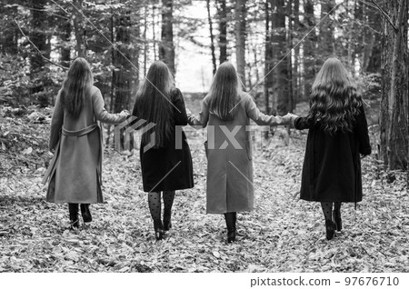 female classmates hold hands and go to the beat. female classmates hold hands and go to the beat. 97676710