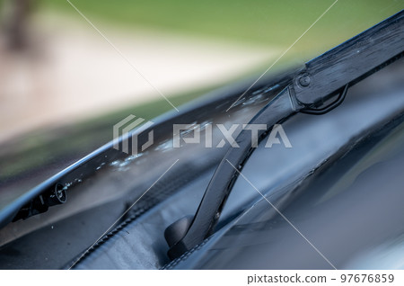 Under hood windshield washer jet used to spray liquid to clean glass on a vehicle.  97676859