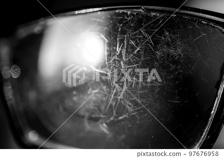 macro of the scratched surface of a polarized sunglasses lens 97676958