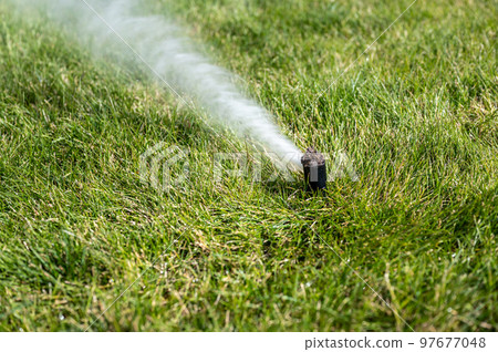 winterizing a irrigation sprinkler system by blowing pressurized air through to clear out water winterizing a irrigation sprinkler system by blowing pressurized air through to clear out water 97677048