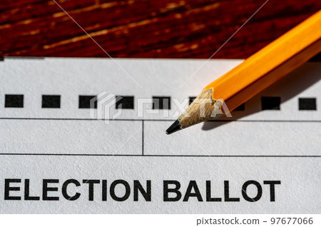 Selective focus on a generic election ballot with a pencil on top. 97677066