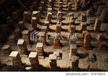 Interior of the Roman baths of Bath. Foundation stone columns 97678003