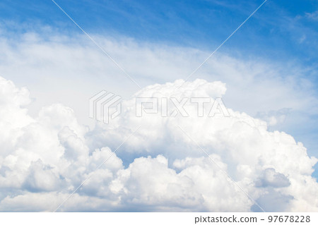 White cumulus clouds in the blue sky, illuminated by the bright spring sun. White cumulus clouds in the blue sky, illuminated by the bright spring sun. 97678228