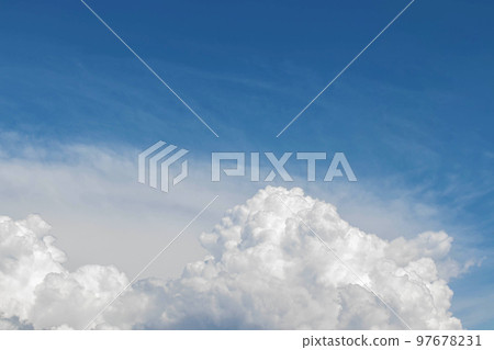 White cumulus clouds in the blue sky, illuminated by the bright spring sun. White cumulus clouds in the blue sky, illuminated by the bright spring sun. 97678231