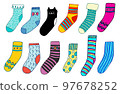 Large set of children's knitted socks, patterned, striped, with dots and bows. There is also a sock in the form of a black cat. 97678252