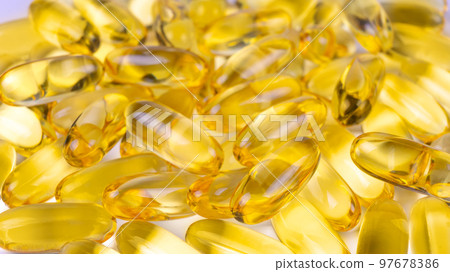 Omega 3 fish oil supplement softgel capsules background. 97678386