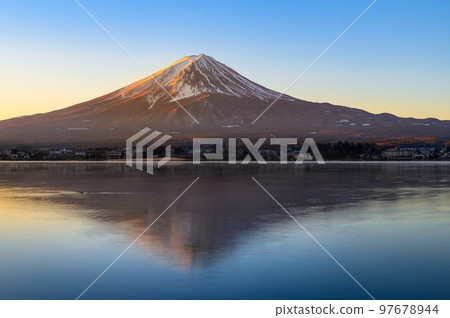 Upside-down red Mt.Fuji in winter seen from the shores of Lake Kawaguchiko Upside-down red Mt.Fuji in winter seen from the shores of Lake Kawaguchiko 97678944