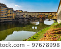 Ponte Vecchio bridge over Arno river in Florence, Tuscany, Italy. 97678998