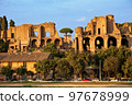 The ancient palace Domus Augustana on the Palatine Hill, view from Circus Maximus. Rome, Italy. 97678999