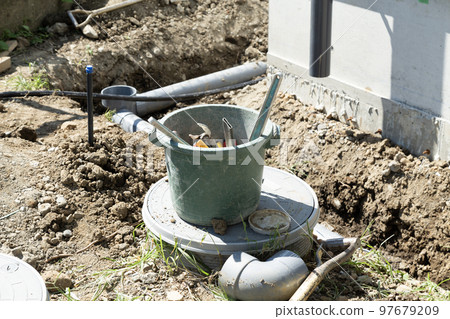 Plumbing work around the septic tank 97679209