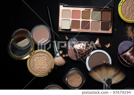 luxery Set of cosmetics with powder, bronzer, eyeshadows, makeup brushes on black background luxery Set of cosmetics with powder, bronzer, eyeshadows, makeup brushes on black background 97679294