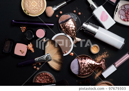 Set of bronze powder with makeup brushes on black background Set of bronze powder with makeup brushes on black background 97679303