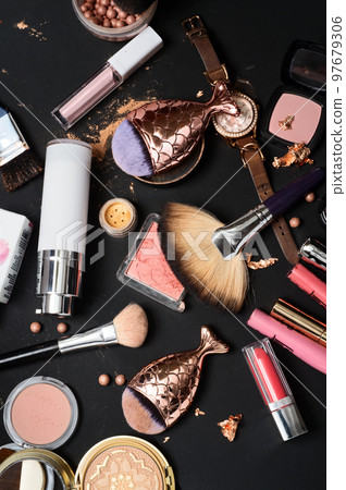 Set of bronze powder with makeup brushes on black background 97679306
