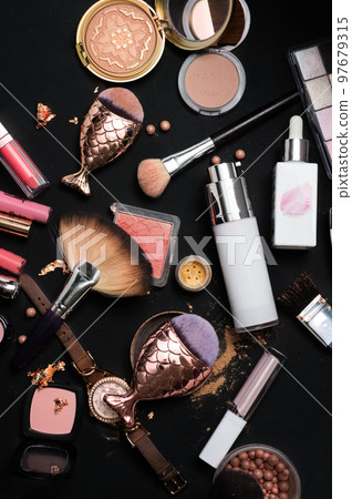 Set of bronze powder with makeup brushes on black background Set of bronze powder with makeup brushes on black background 97679315