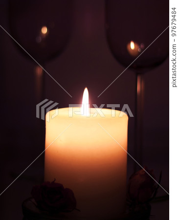 holiday candle with rose agaist dark background. romantic concept holiday candle with rose agaist dark background. romantic concept 97679484