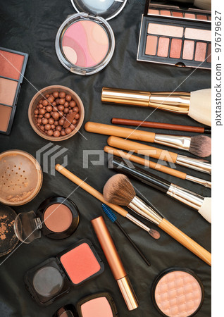 Set of make up brushes  with cosmetics on black background 97679627