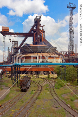 A huge blast furnace at a steelworks. A huge blast furnace at a steelworks. 97680650