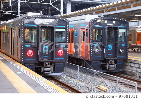 JR Kyushu YC1 series diesel train stopping at Isahaya Station on the Omura Line JR Kyushu YC1 series diesel train stopping at Isahaya Station on the Omura Line 97681311