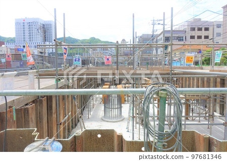 Foundation work at a building construction site Foundation work at a building construction site 97681346
