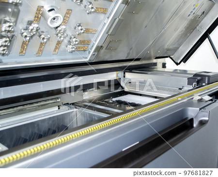 Top of large industrial printer with lid open. Multi Jet Fusion. Large industrial 3D printer printing polyimide powder. Industrial equipment. New modern 3D printing additive progressive technology MJF Top of large industrial printer with lid open. Multi Jet Fusion. Large industrial 3D printer printing polyimide powder. Industrial equipment. New modern 3D printing additive progressive technology MJF 97681827